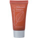 An Ecossential Naturals 0.5 oz. bottle of shampoo and conditioner with a white line drawing of a leaf.
