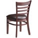 A Lancaster Table & Seating mahogany wood ladder back chair with dark brown vinyl seat on a white background.