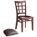 A Lancaster Table & Seating mahogany wood restaurant chair with a detached dark brown vinyl seat.