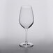 A close up of a clear Lucaris Temptation Chardonnay wine glass.