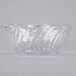 A clear polycarbonate bowl with wavy edges.
