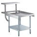 A Regency stainless steel equipment stand with two shelves holding a metal work surface and a plate shelf.