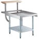 A Regency stainless steel equipment stand with a galvanized undershelf and wooden cutting board.