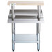 A Regency stainless steel equipment stand with a galvanized shelf and wooden cutting board.