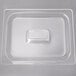 A clear plastic food pan lid with a rectangle in the middle.