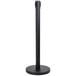 A black Aarco crowd control stanchion pole with a round base.