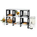 A white Cal-Mil modular library display shelf holding food, drinks, and flowers.