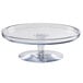 A clear polycarbonate Cal-Mil pedestal cake stand.