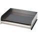 A rectangular metal griddle with a black surface and silver trim.