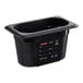 An Araven black plastic food pan with a lid on a counter.