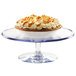 A pie on a clear Cal-Mil polycarbonate footed pedestal cake stand.