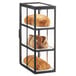 A black Cal-Mil bakery display case with bread and croissants.