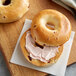 A New York Style Cranberry Bagel with cream cheese on top.