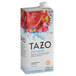 A carton of Tazo Sweetened Passion Iced Tea Concentrate with a red and blue label.