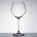 A clear Chef & Sommelier Cabernet wine glass on a table.