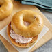 A New York Style French Toast bagel with cream cheese on top.