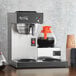 An Avantco automatic coffee maker with coffee pots on a counter.