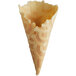 A close-up of a Konery French vanilla waffle cone with a cut out inside.