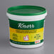 A white container of Knorr Chicken Bouillon Base with a green lid.