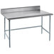 An Advance Tabco stainless steel work table with an open base and a backsplash.
