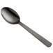 An American Metalcraft hammered black serving spoon with a silver bowl and handle.