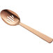 A close-up of an American Metalcraft hammered bronze slotted serving spoon with a rose gold handle.