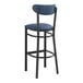 A Lancaster Table & Seating black bar stool with navy blue vinyl seat and back.