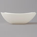 A white Fineline plastic serving bowl with a curved edge on a gray background.