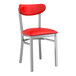 A Lancaster Table & Seating red metal chair with clear coat finish and red vinyl seat and back.