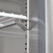 An Avantco stainless steel worktop freezer shelf with white brackets.