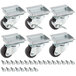 A group of Avantco ADA height plate casters with black wheels and metal screws.
