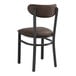 A black Lancaster Table & Seating chair with dark brown vinyl seat and back.
