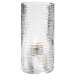 A Hollowick clear glass cylinder candle holder with a candle inside.