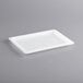 A white rectangular Vigor polyethylene lid on a white tray.
