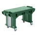 A green Cambro Versa work table with heavy duty casters.