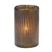 A Hollowick mocha glass cylinder candle holder with a brown stripe holding a lit candle.