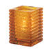 A Hollowick amber glass jewel square candle holder.