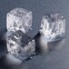 A close-up of three Hoshizaki regular ice cubes.