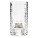 A clear glass Hollowick Typhoon cylinder candle holder with a lit candle inside.