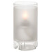 A large frosted glass candle holder with a lit candle.