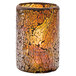 A Hollowick crackle gold glass cylinder candle holder with a lit candle inside.