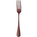 A close-up of a Sola Baguette vintage copper dessert fork with a brown handle.