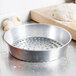 An American Metalcraft silver metal pan with holes in it filled with dough.
