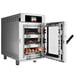 A white Alto-Shaam Vector H Series multi-cook oven with food inside.