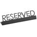 An American Metalcraft black metal tabletop sign with "Reserved" print.
