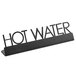 An American Metalcraft black laser-cut sign holder with "Hot Water" text on a counter.
