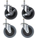 Four black and grey Carlisle swivel stem casters with wheels.