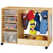 A Jonti-Craft wooden dress up center with bins filled with clothes and toys.