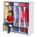 A child sitting on a blue and gray Rainbow Accents coat locker with colorful coats hanging inside.