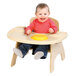 A baby sitting in a Jonti-Craft wood high chair with a tray.